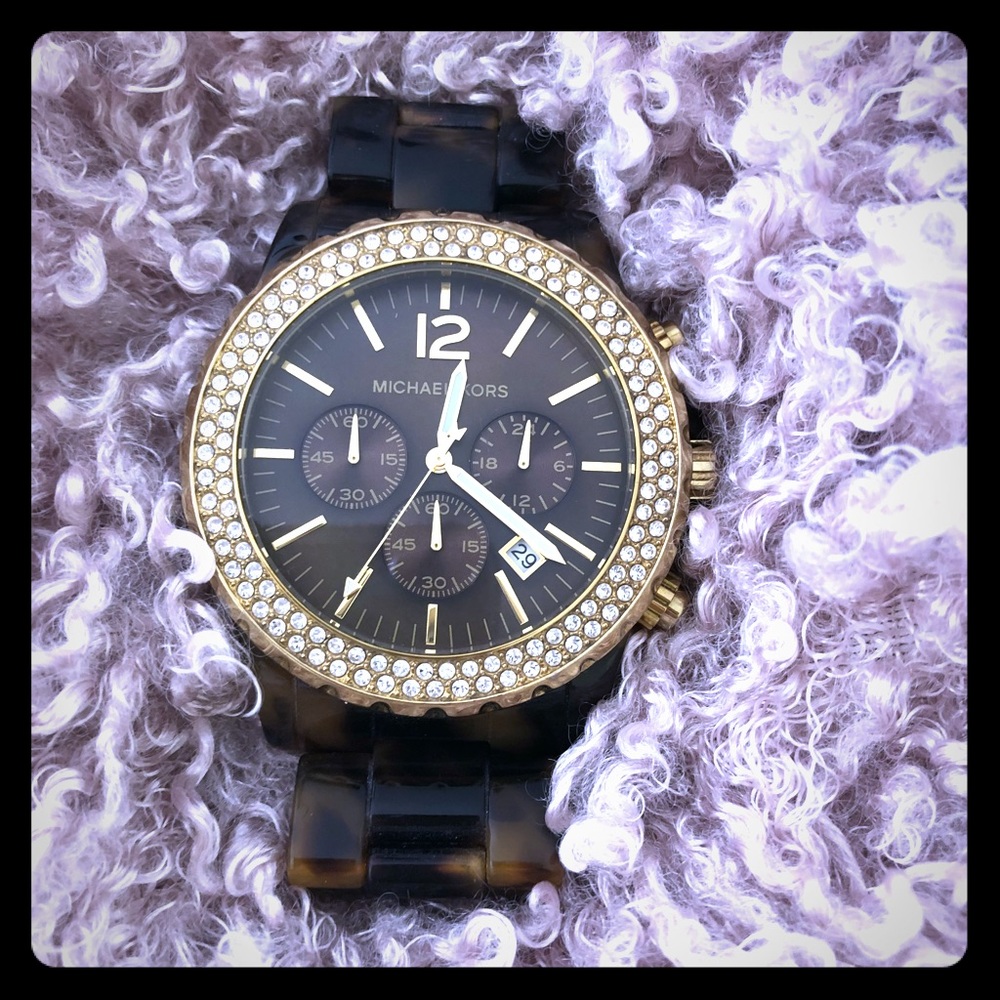 Michael Kors tortoise band with a bling face.